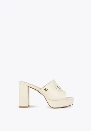 Heeled clogs with decorative buckle