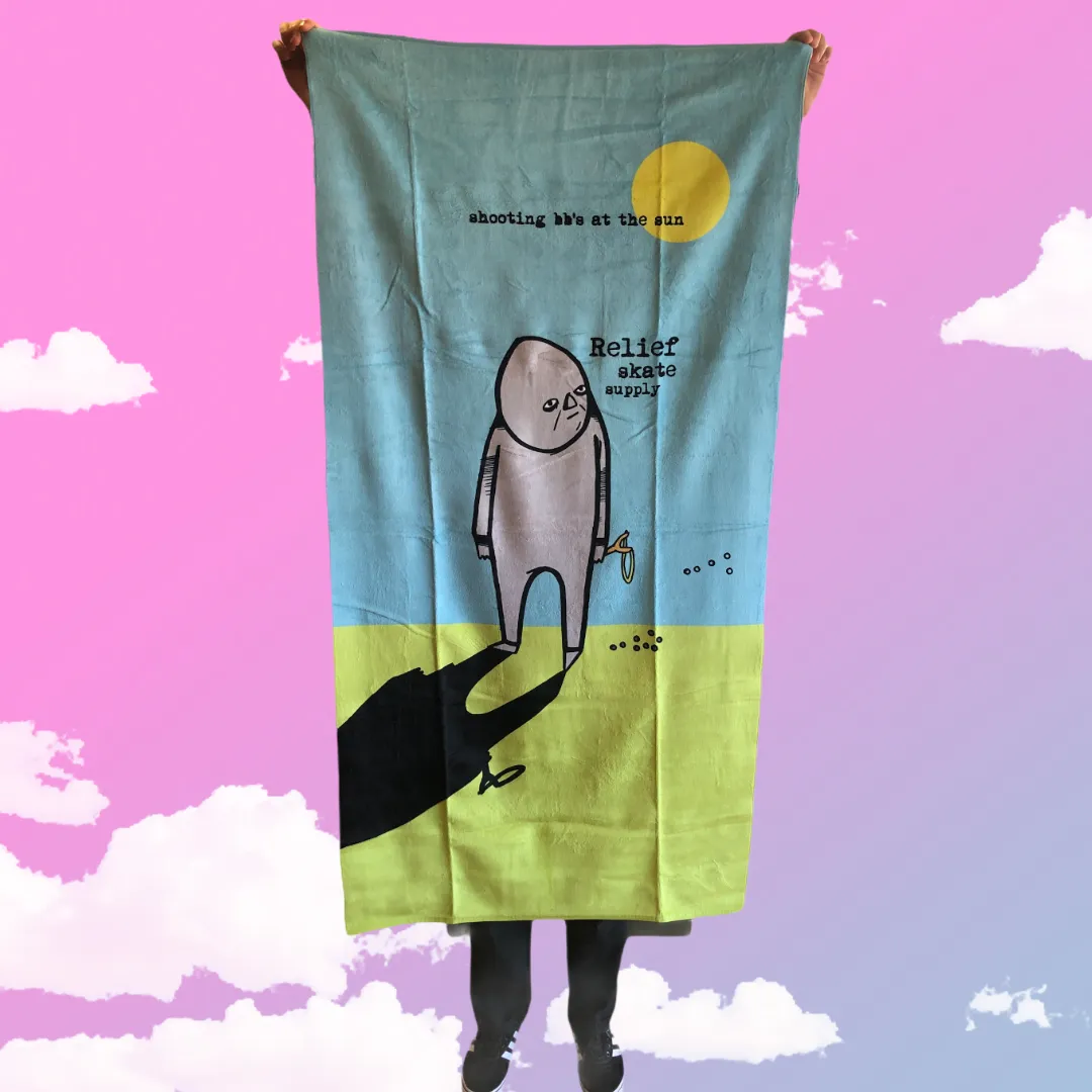 RELIEF SHOOTING BB’S AT THE SUN LARGE TOWEL 30” x 60”